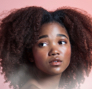 A person with beautiful curly hair