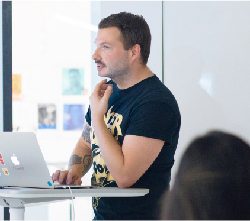 Instructor sitting at desk