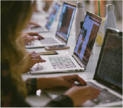 Students implementing code on their labtops